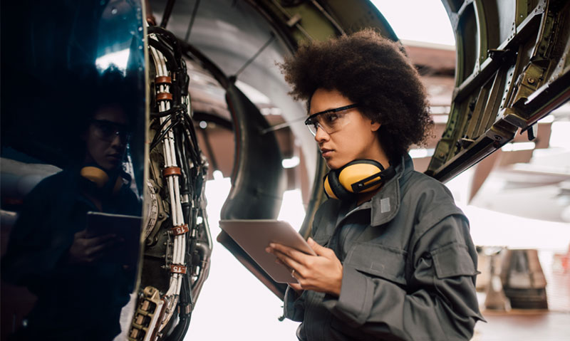 aircraft engineer looking at an aircraft engine